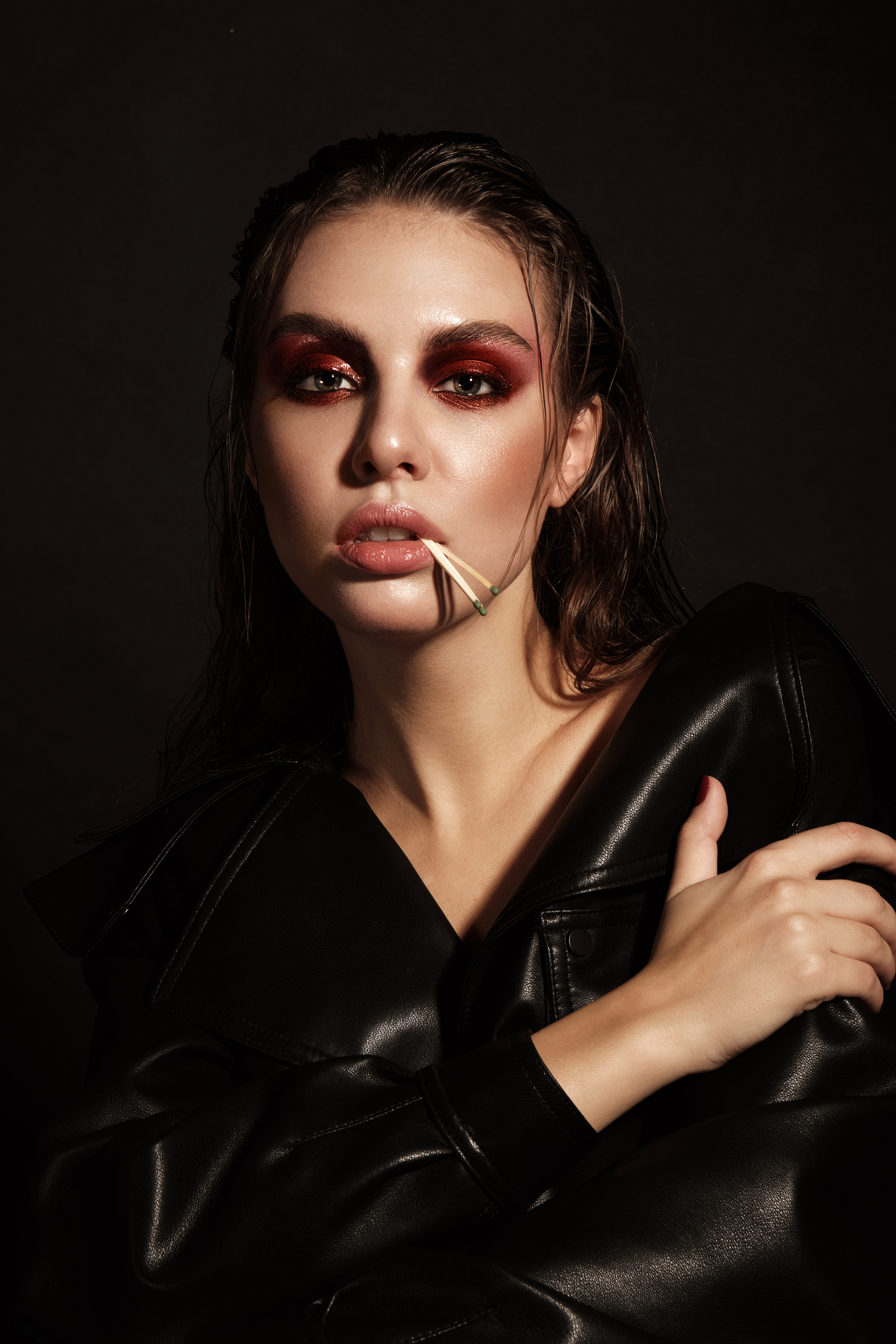 Portrait of a beautiful woman in a rock style image with creative makeup and hairstyle.